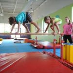 Kids develop balancing skills during summer camps at The Little Gym