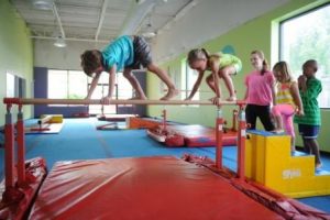 Kids develop balancing skills during summer camps at The Little Gym